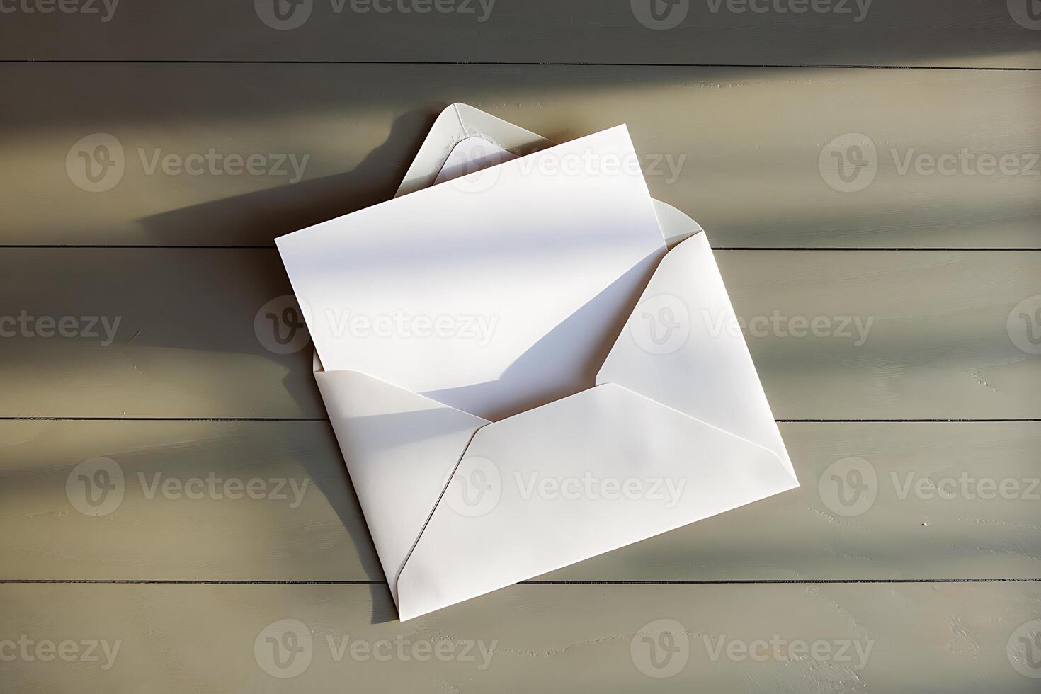 A Blank White Envelope and Card Resting on a Wooden Surface photo