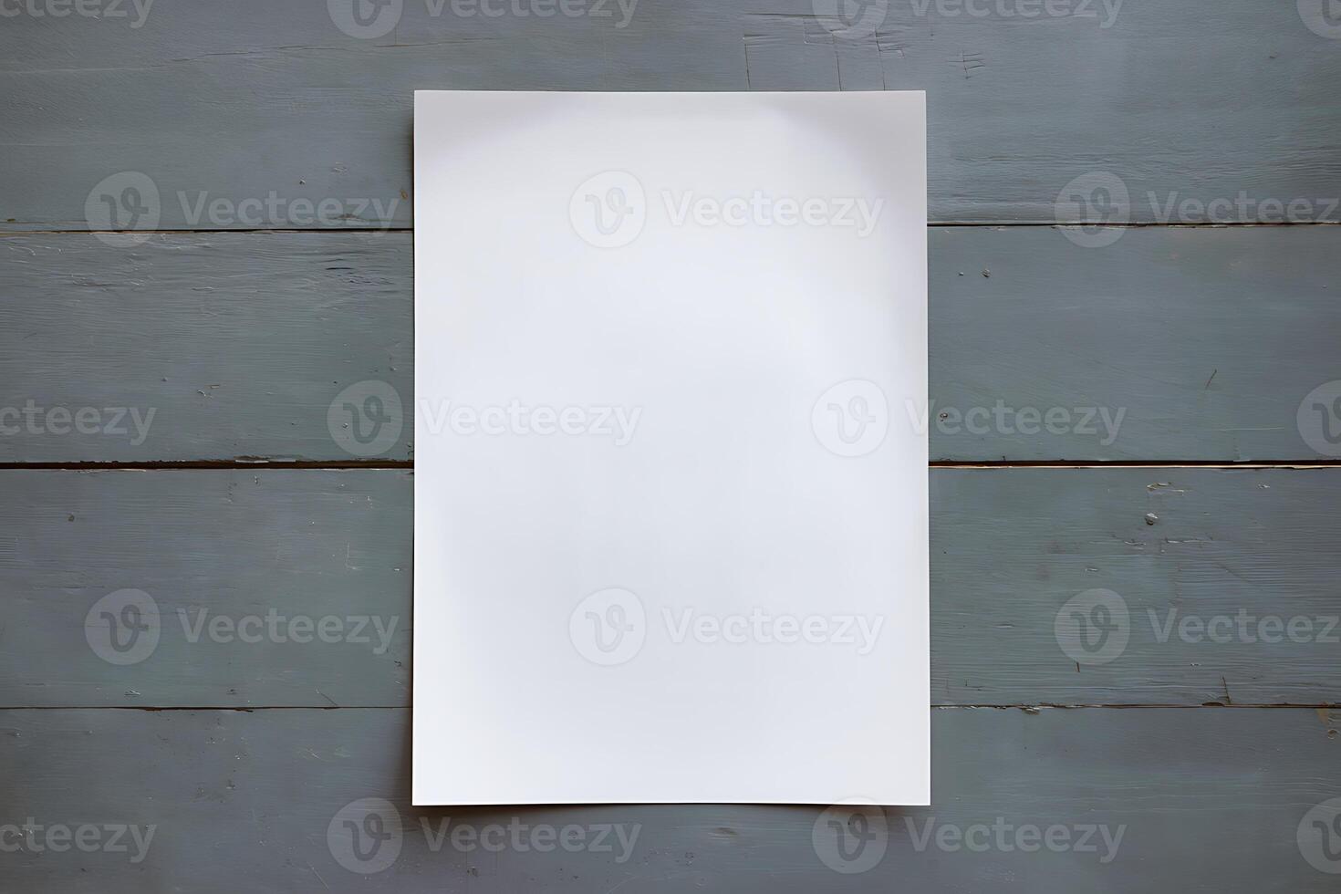 Blank White Paper on a Grey Wooden Surface photo