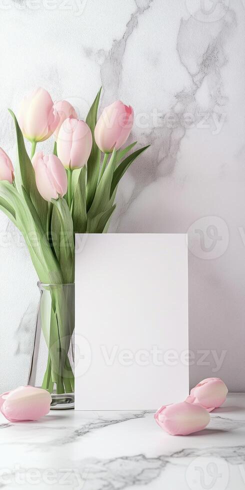 Elegant still life with pink tulips and blank card on marble surface for design inspiration photo