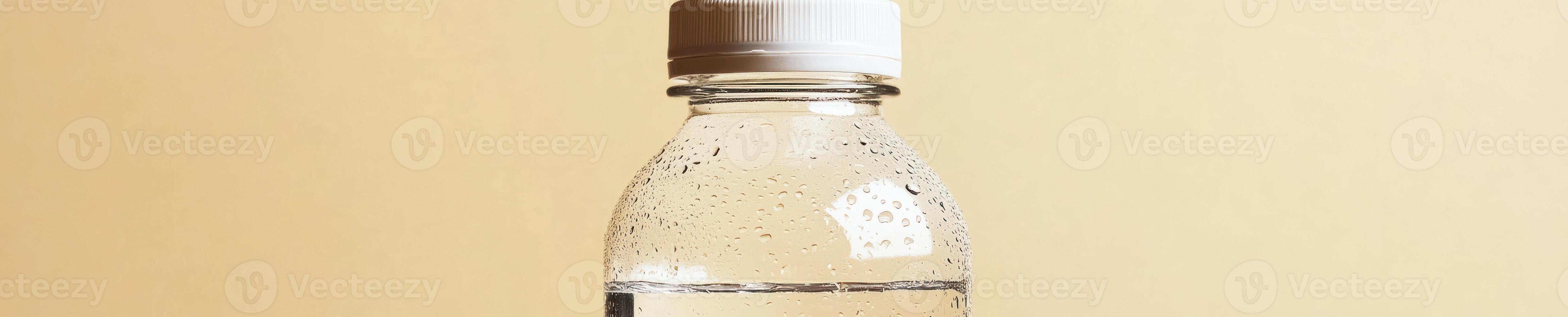 Refreshing transparent water bottle with condensation drops for hydration and freshness photo