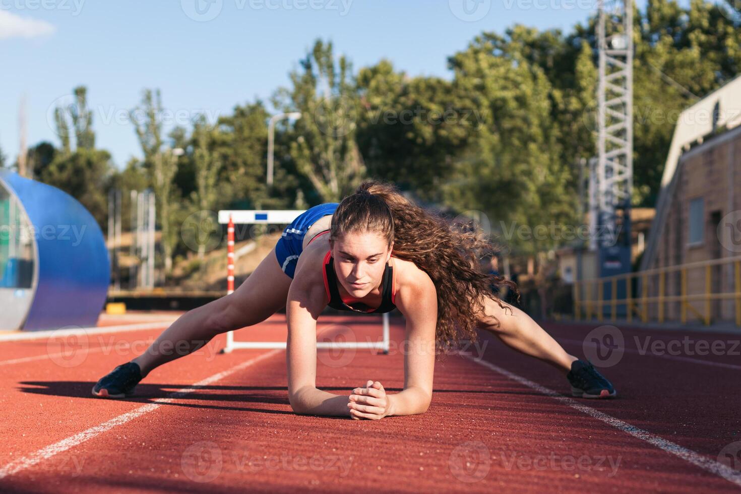 A young woman is on the track in a race photo
