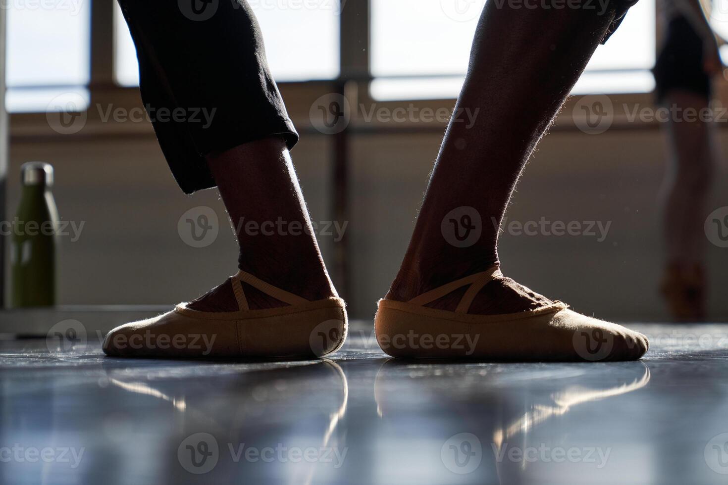 A pair of ballet shoes on a floor photo