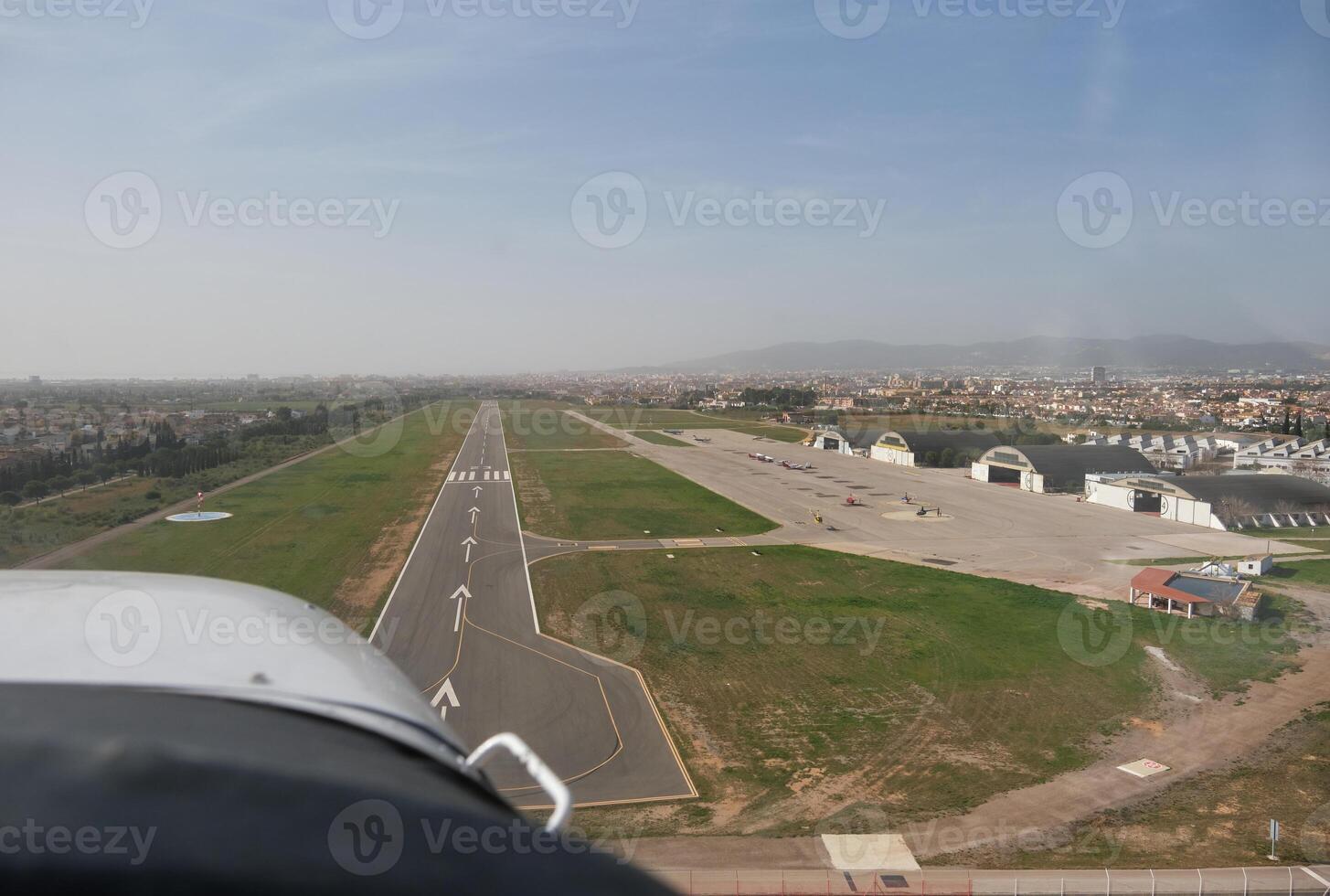 A view of a runway from an airplane. photo