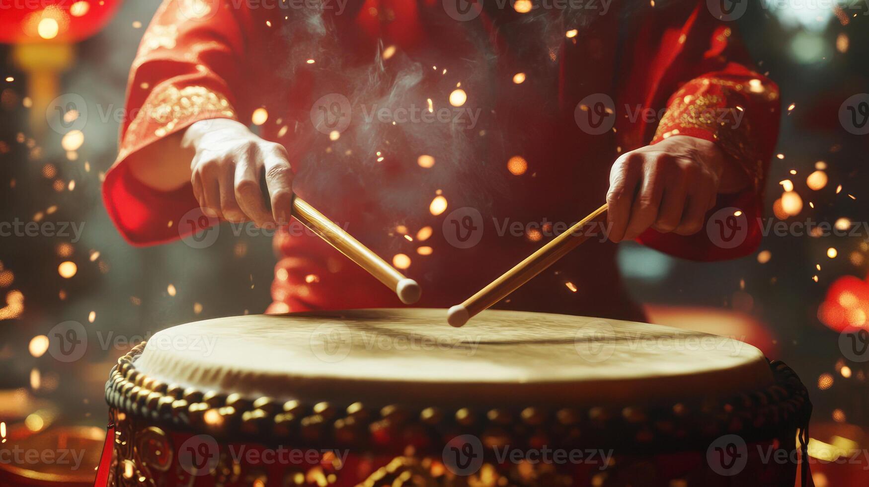A vibrant performance featuring hands playing a traditional drum. photo