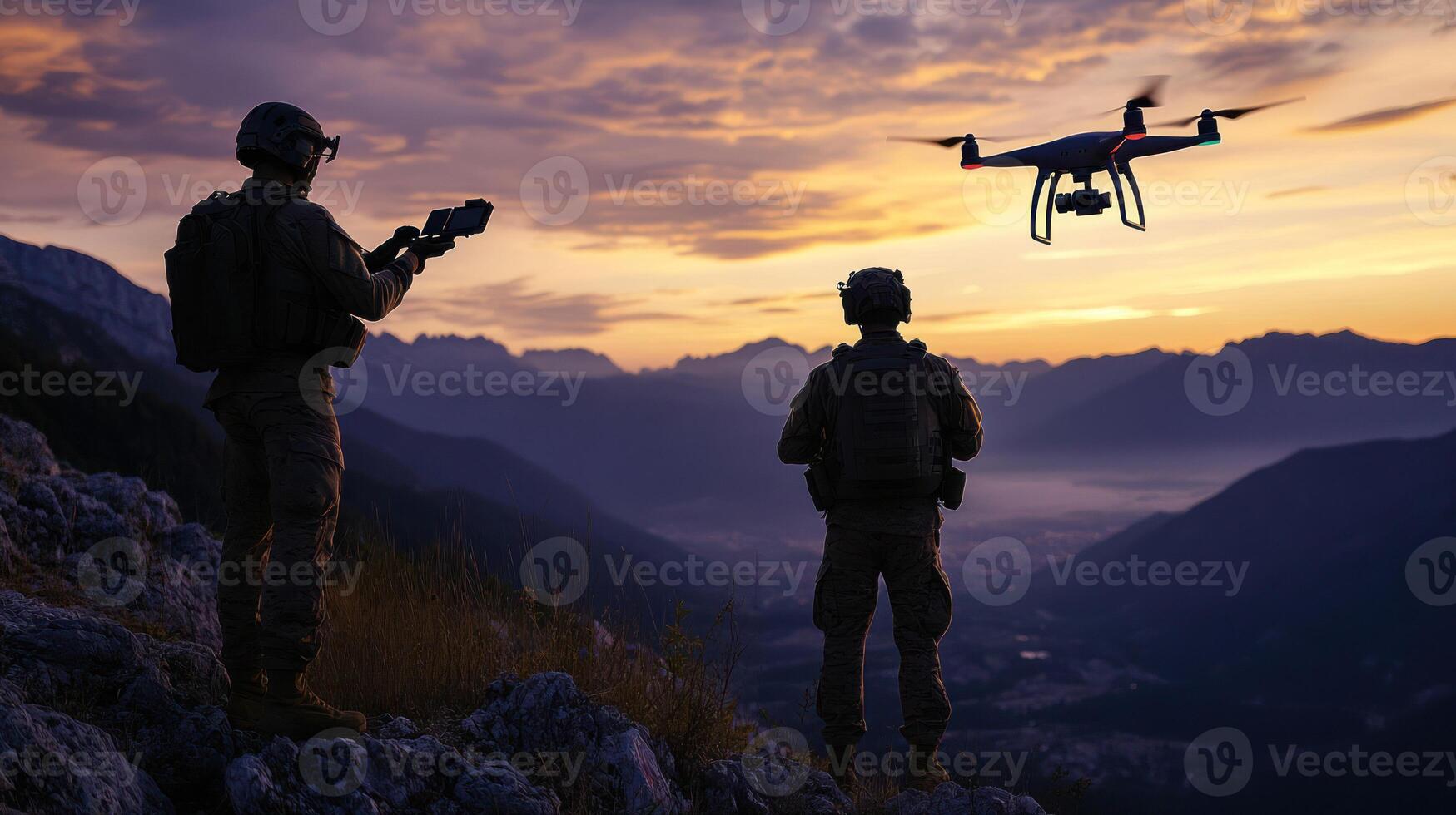 Two soldiers operate a drone against a stunning sunset backdrop. photo