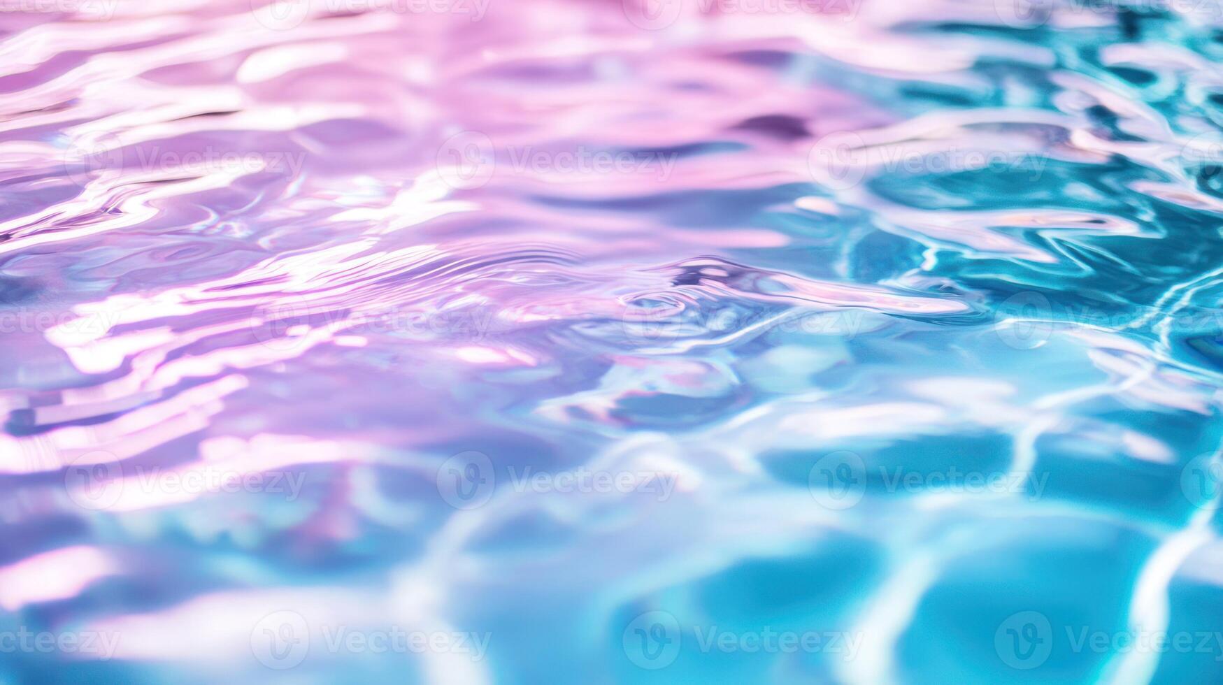 A tranquil blend of pink and turquoise water with soft ripples. photo
