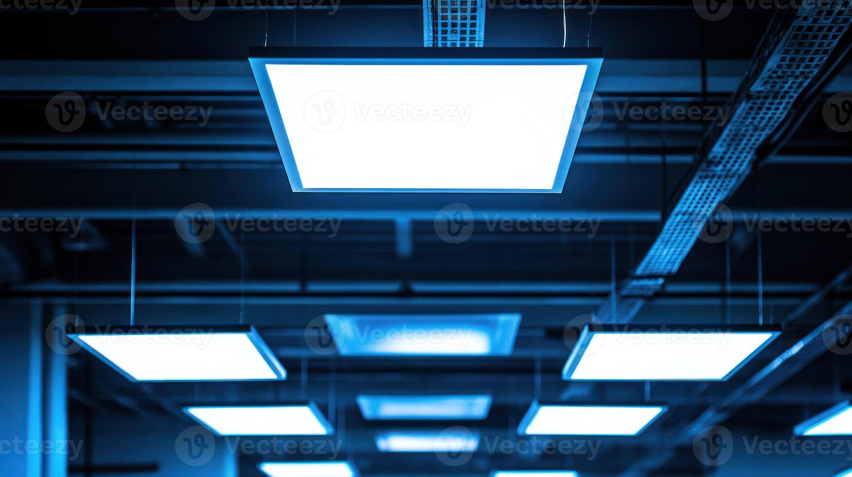 A modern ceiling with bright, square lights in a minimalistic setting. photo