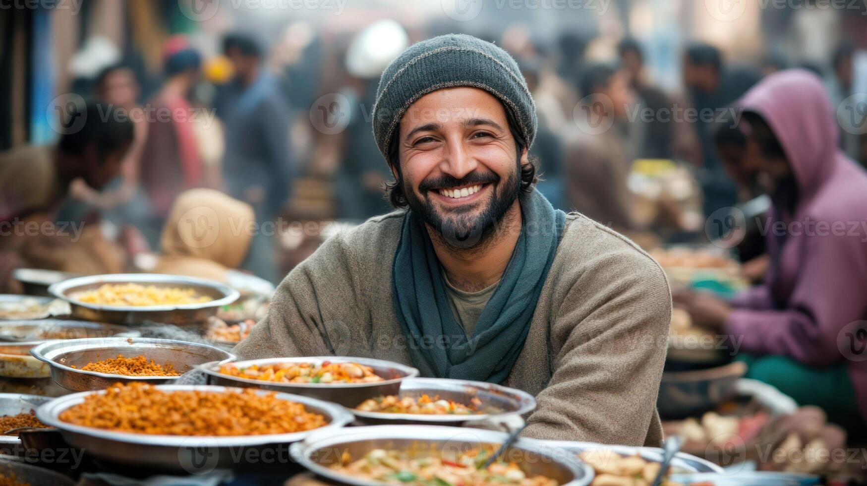 A smiling man at a vibrant street food market surrounded by dishes. photo