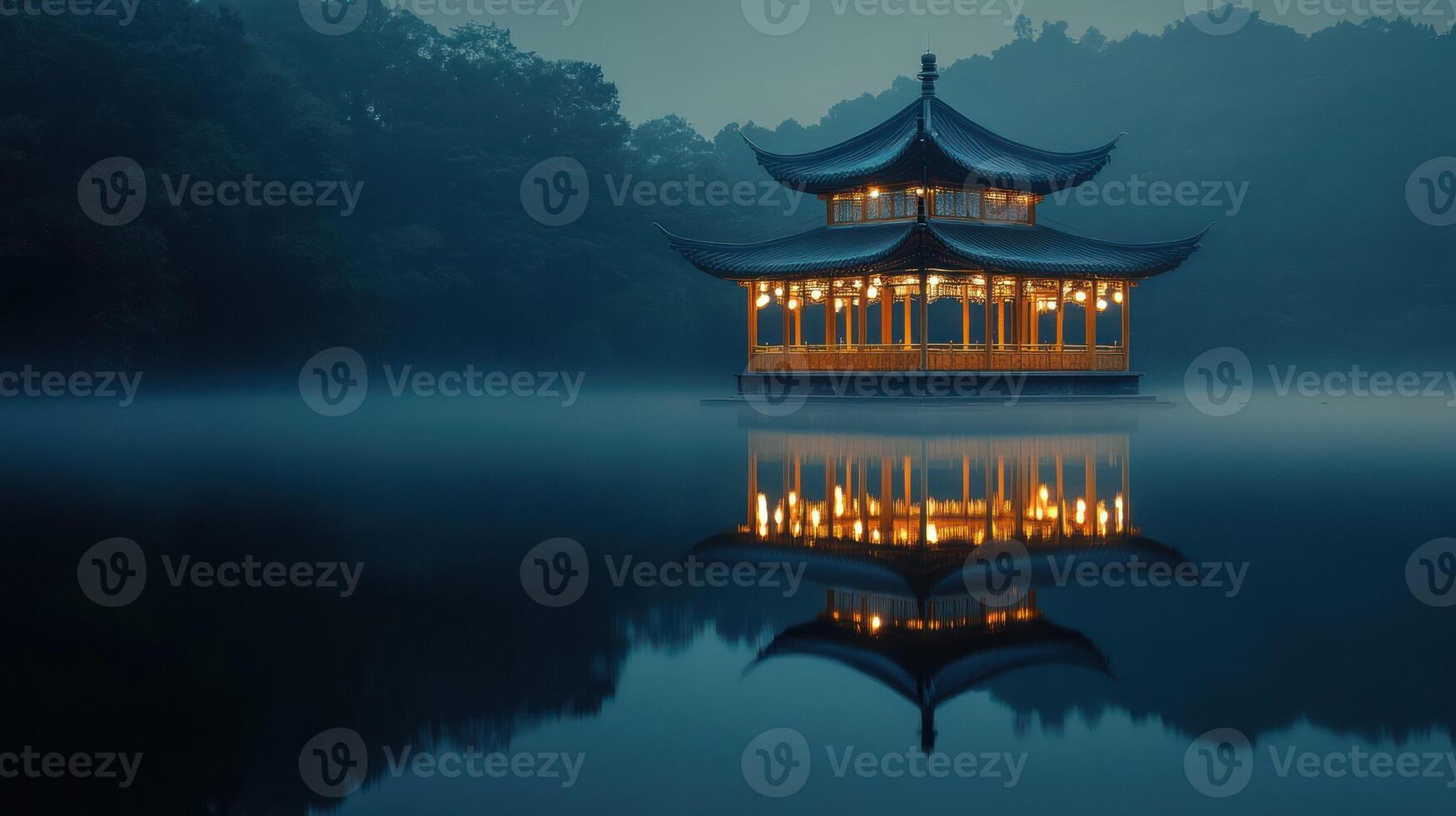 A serene pavilion reflected on misty waters at dusk. photo