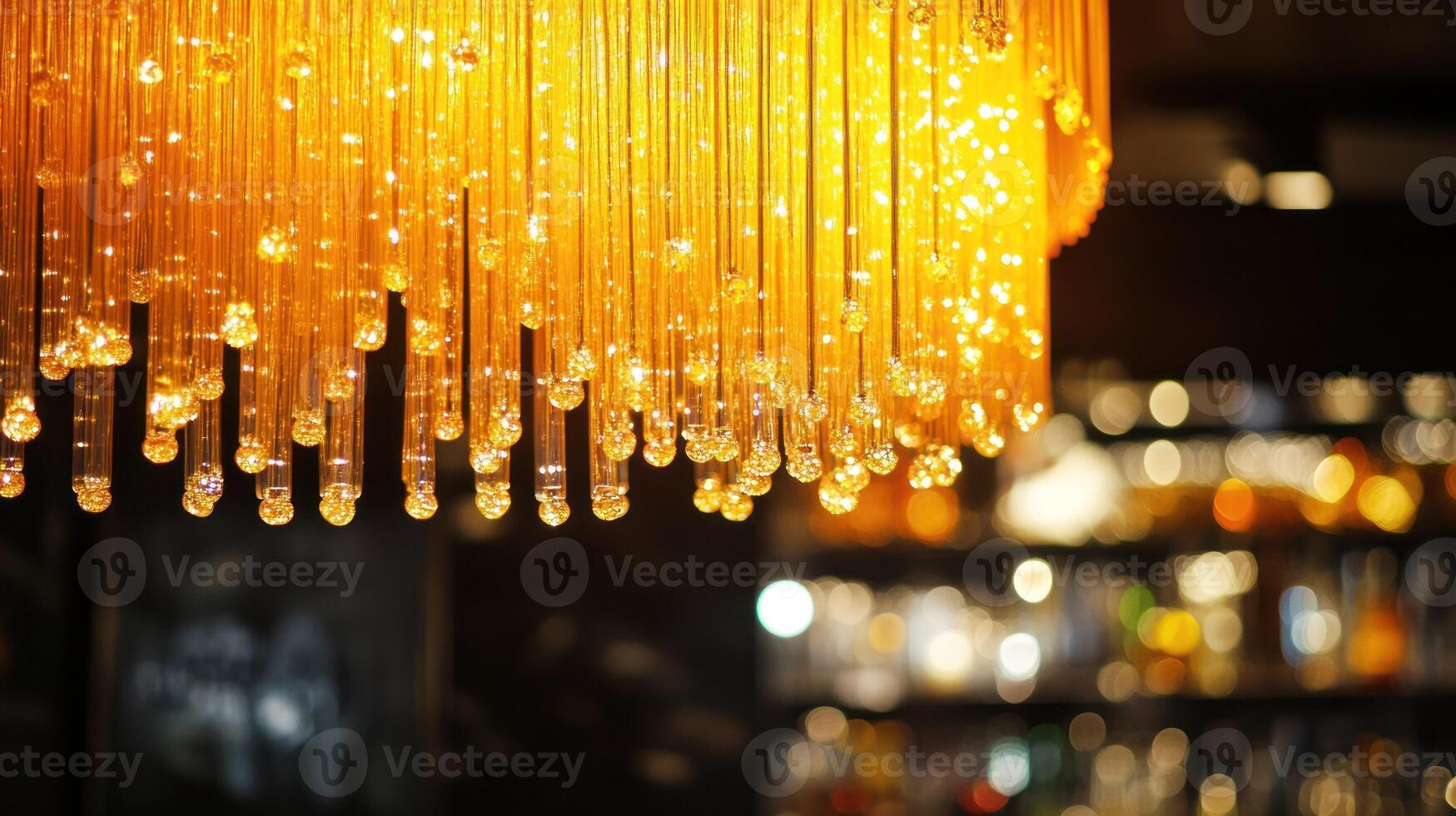A stunning chandelier casting a warm glow, enhancing the elegant ambiance. photo