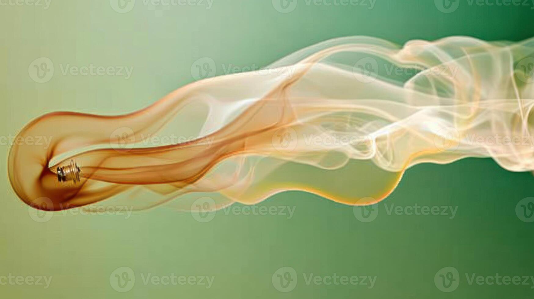 A serene swirl of colorful smoke flowing gracefully against a soft backdrop. photo
