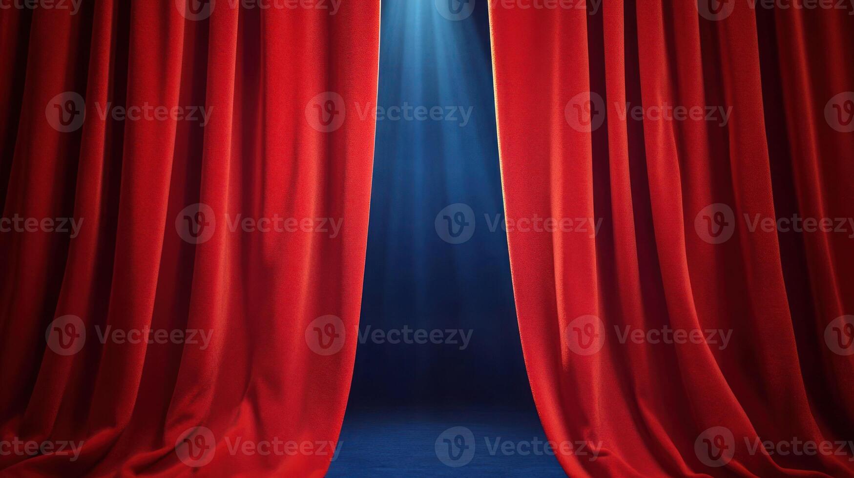Red curtains parting to reveal a spotlighted stage for a performance. photo