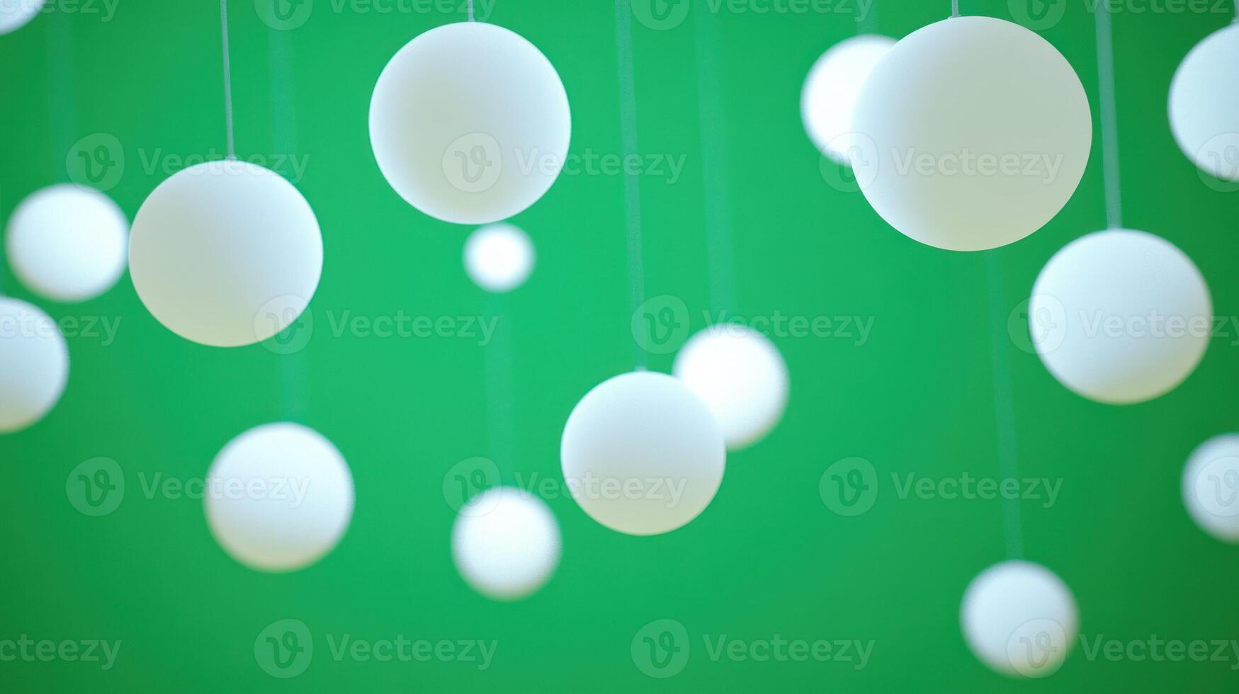 Floating white spheres create a minimalist and tranquil atmosphere. photo