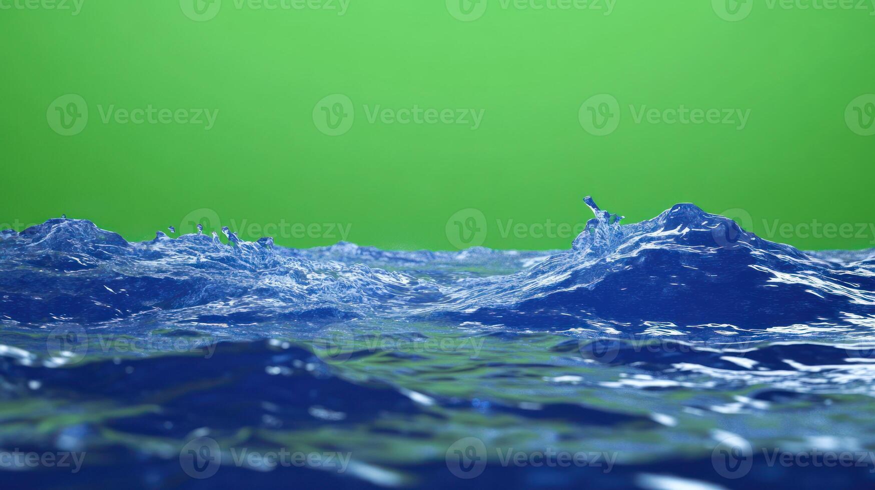 Rippling blue water surface with a vibrant green background. photo