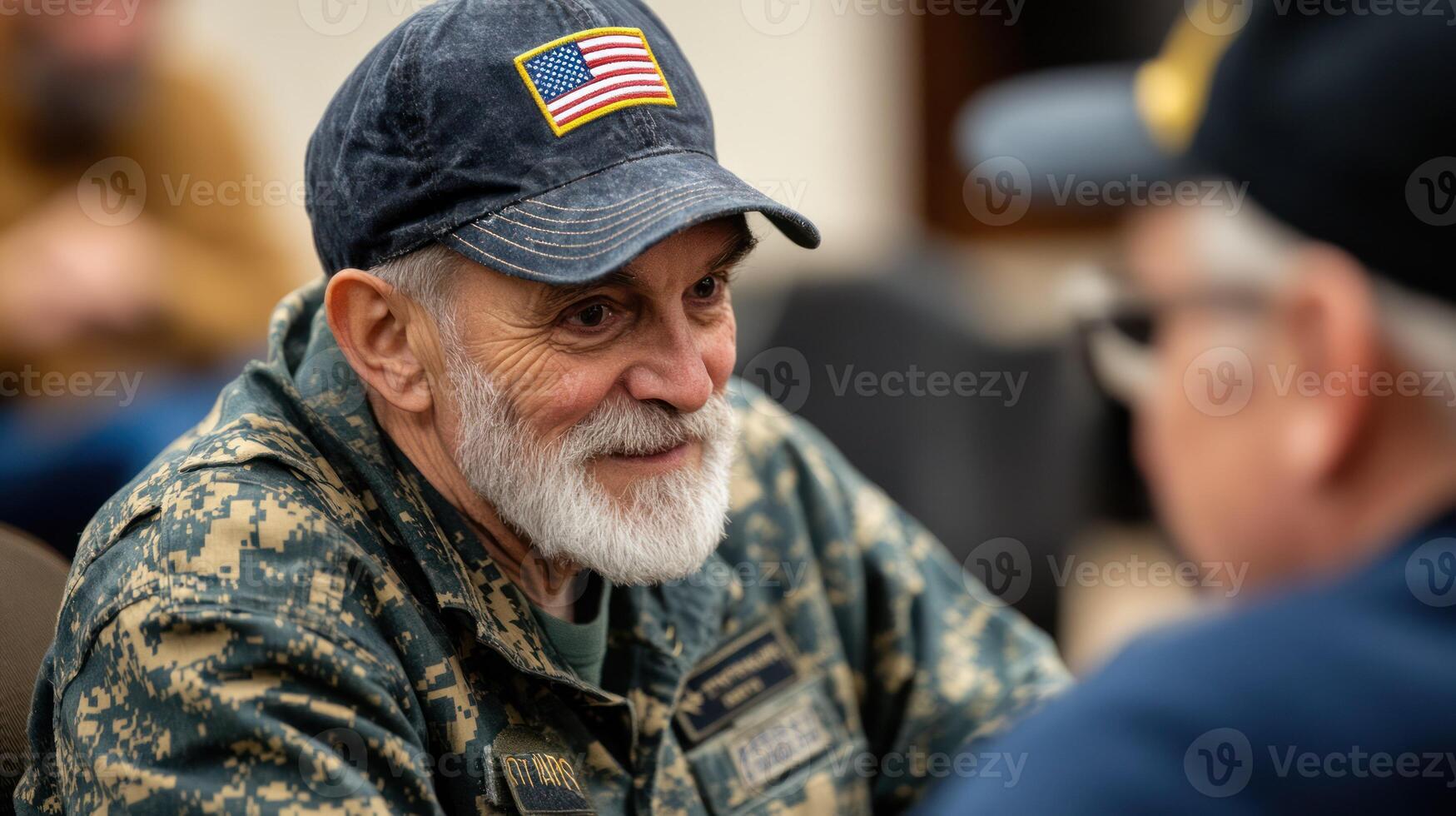 A smiling veteran engages in a warm conversation with a friend. photo