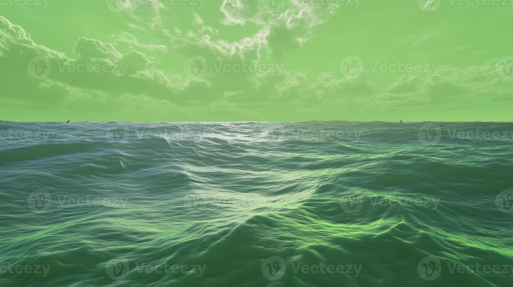 A tranquil green sea under a cloudy sky, evoking serenity and calm. photo