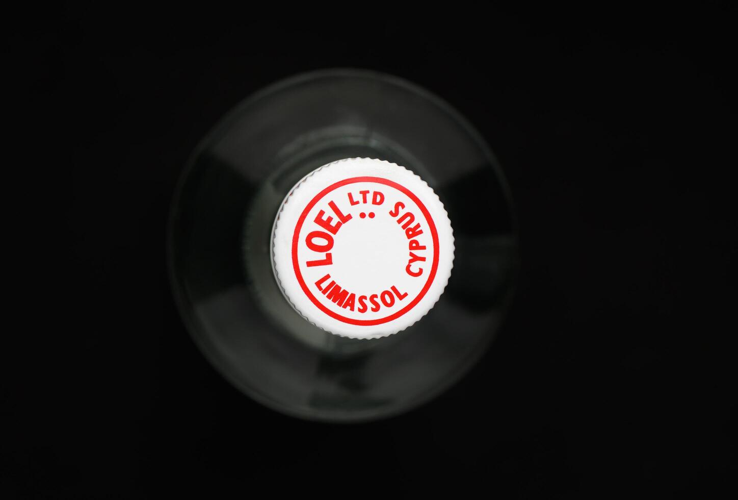 Gaziveren Cyprus -12.03.2025 Clear glass bottle vodka Loel Zivana showcasing a label from Limassol, Cyprus, with a vintage design and intriguing details photo
