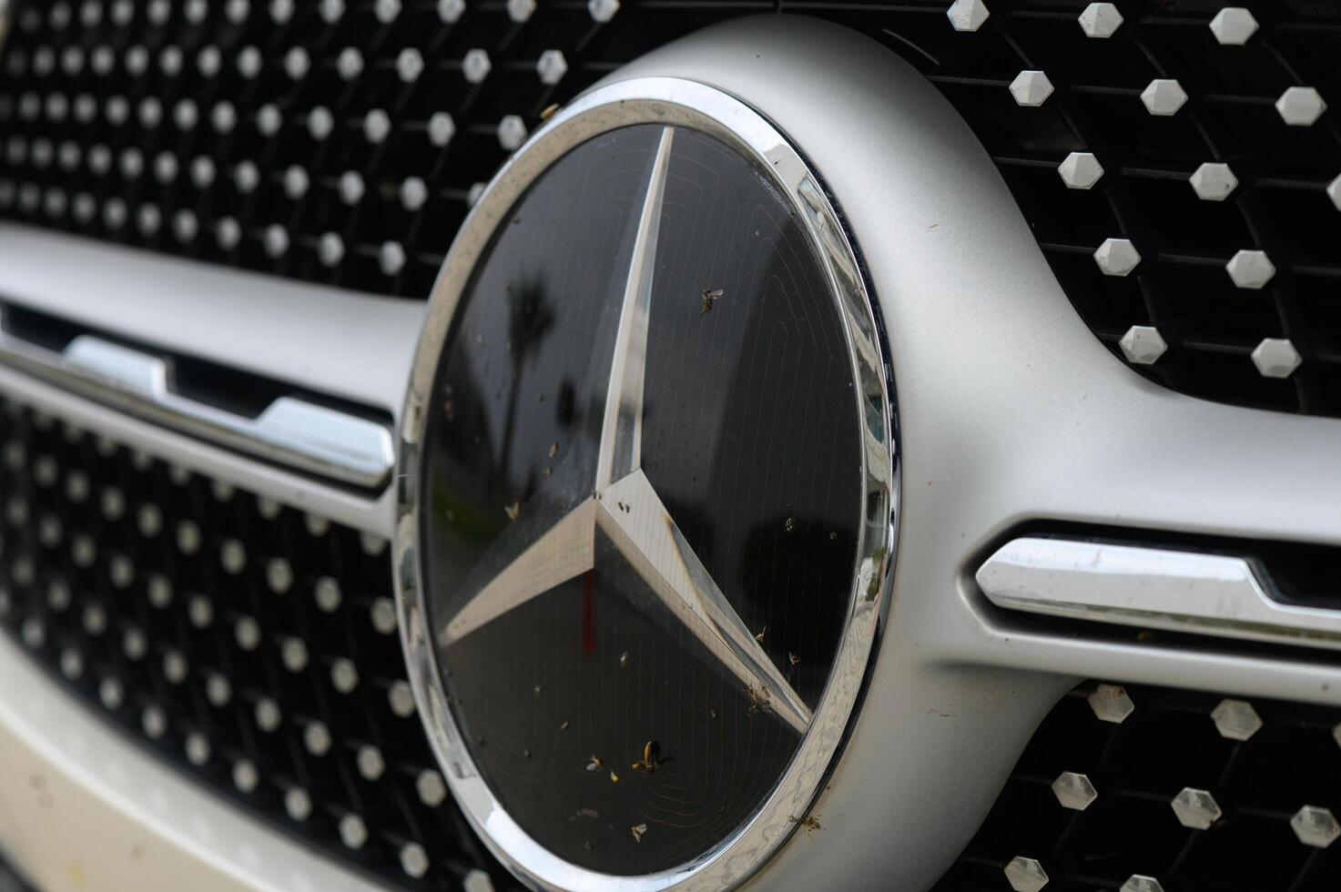 Gaziveren Cyprus -17.03.2025 Mercedes-AMG Elegance in motion Close-up of a luxury automobile emblem reflecting adventure and craftsmanship on a sunny day photo