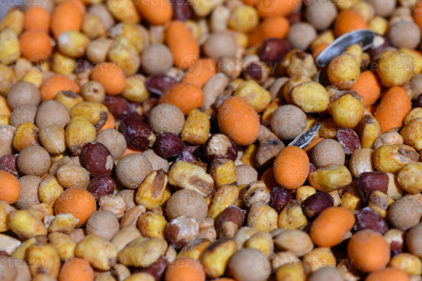 Colorful blend of seeds and grains creating a vibrant natural display for wildlife feeding photo