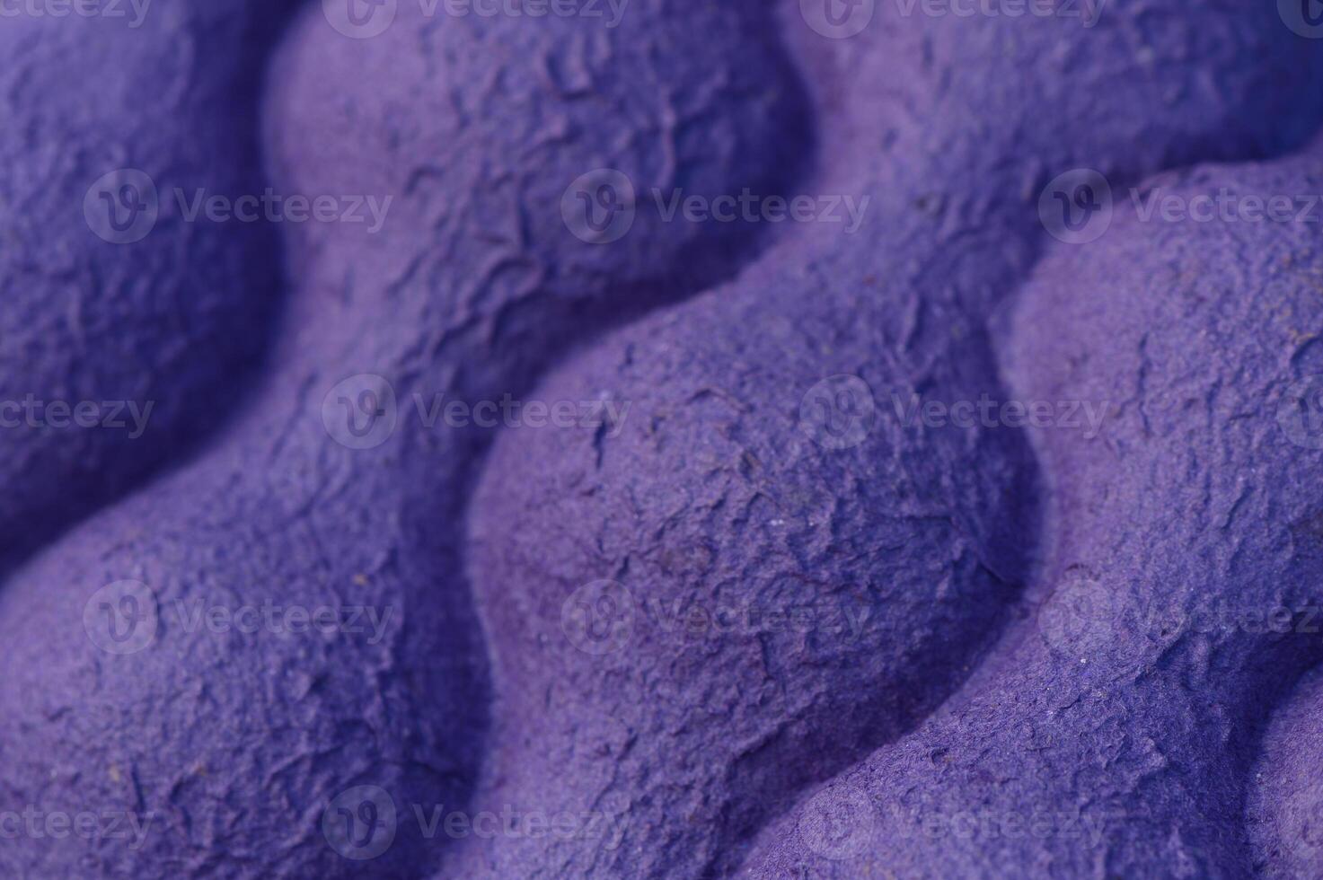 Exploring the intricate textures of a vibrant purple surface in close detail during daylight photo