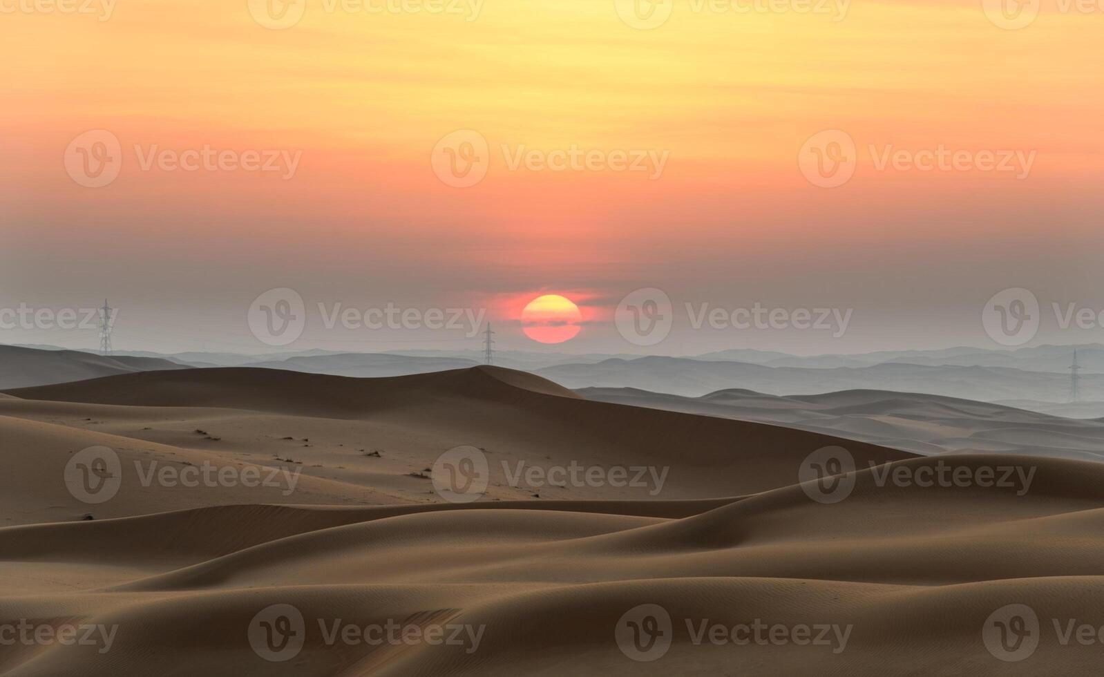 The sun sets over the desert in the middle of the day photo