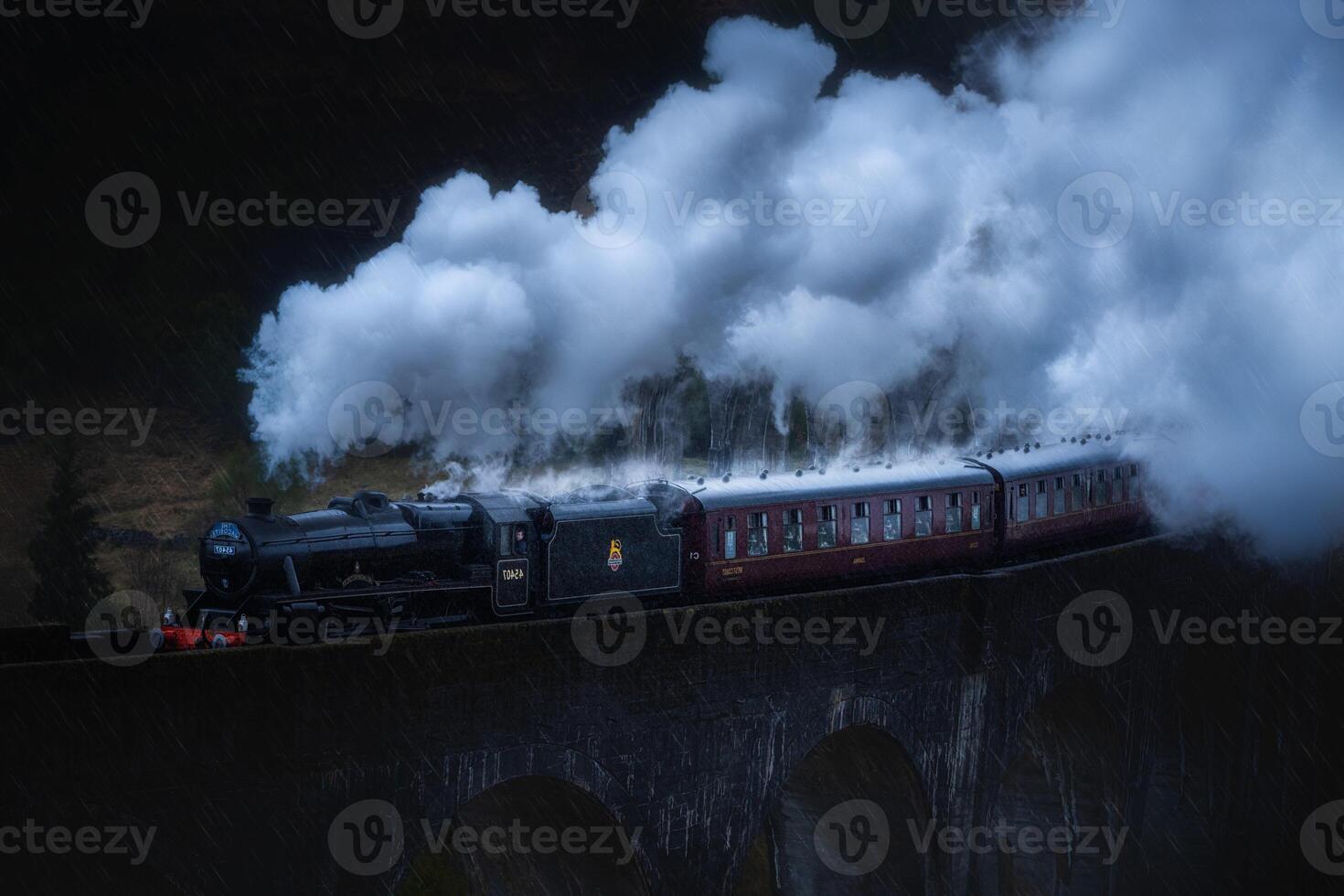A train traveling on a bridge with steam coming out of the train photo