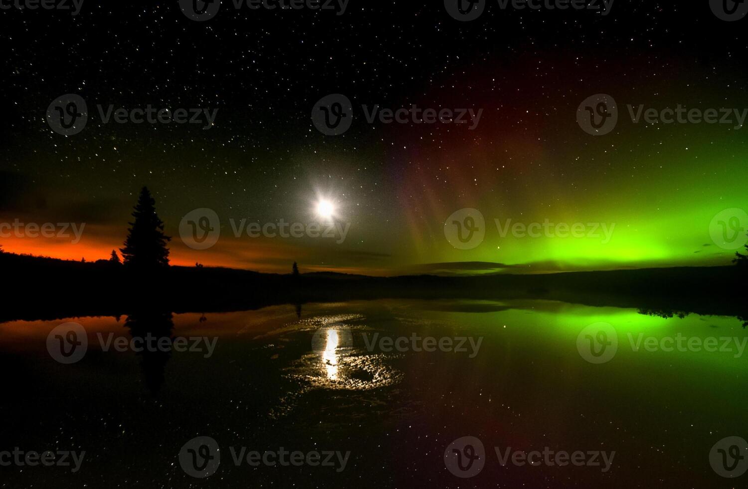 The aurora borealis is reflected in the water photo