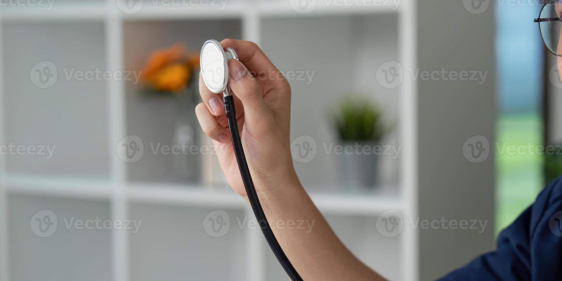 Stethoscope and Patient Monitoring. A medical student preparing to check vital signs with a stethoscope in hand. photo