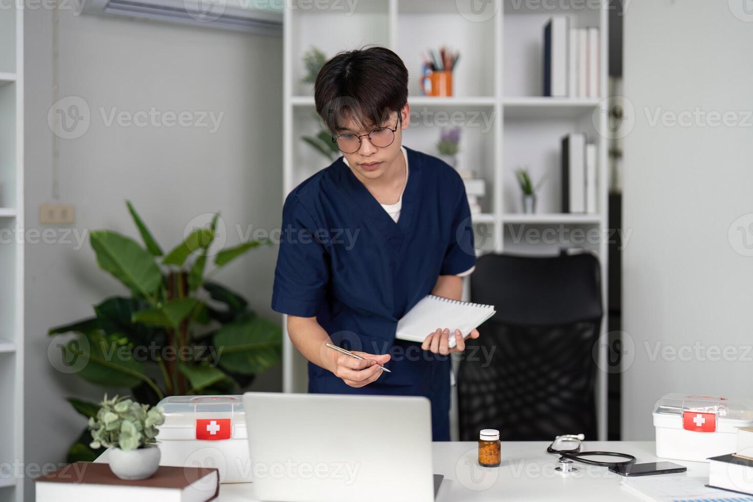 Interactive Learning and Collaboration. A medical student actively engages in study, balancing research and note-taking for professional growth. photo
