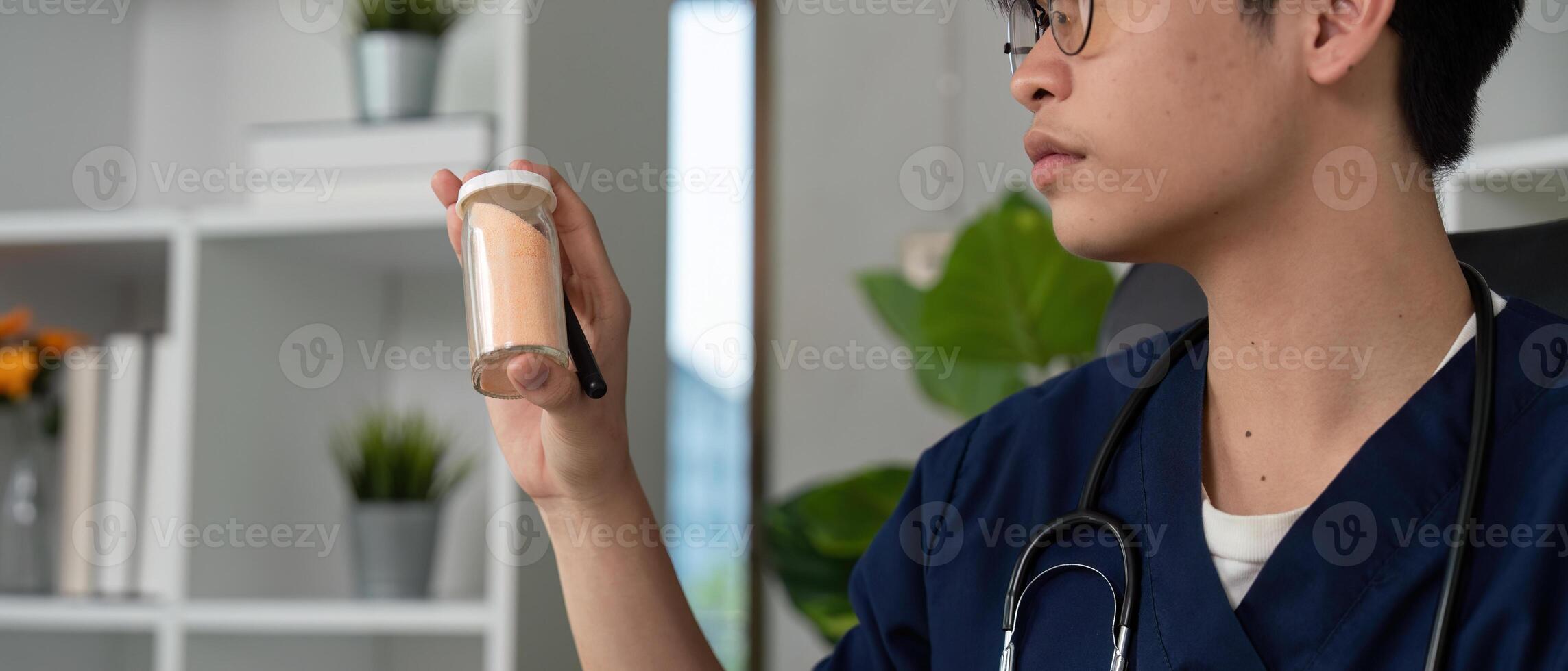 Medication Management and Student Understanding. A medical student studying medication concepts with a prescription bottle in hand. photo