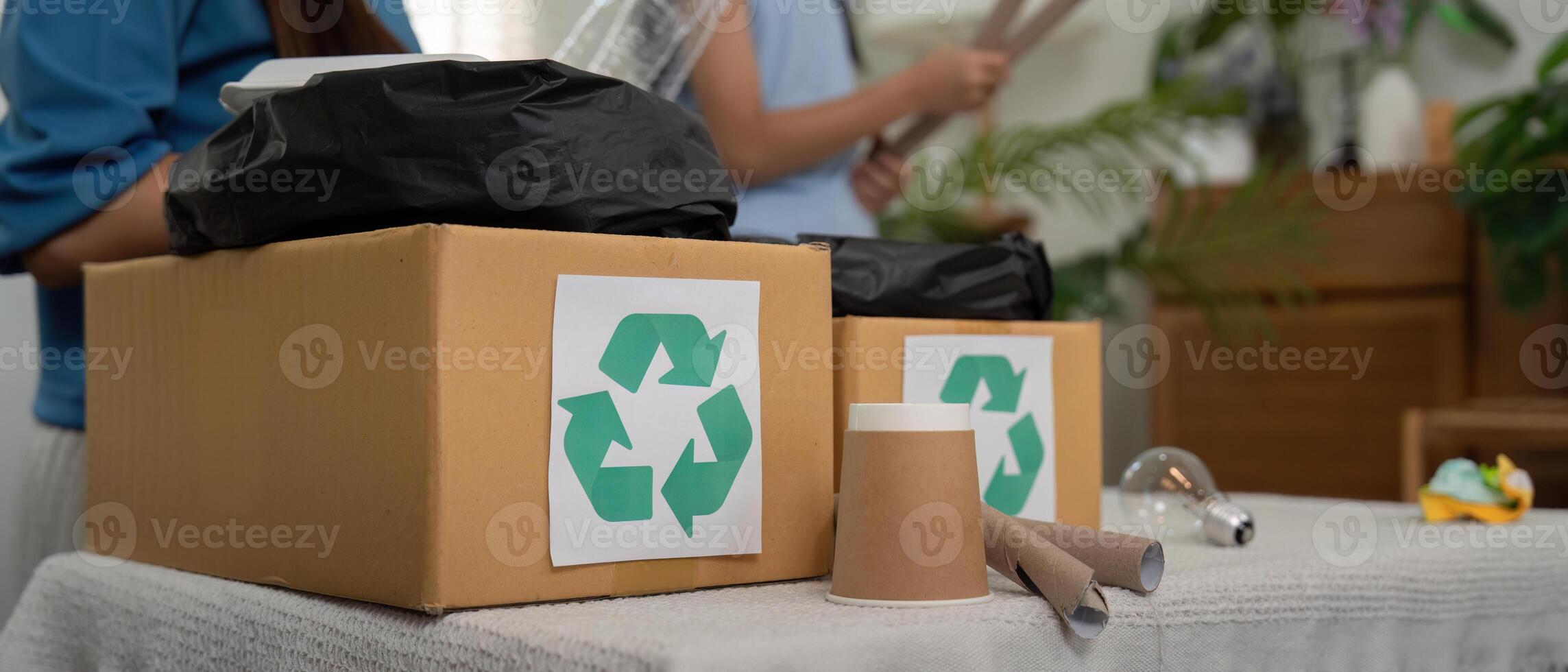Recycling and Eco-Friendly Practices. A family engaging in sustainable activities by sorting recyclables together. photo