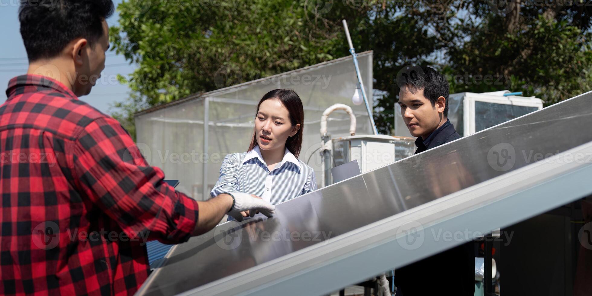 Sustainable Solutions and Team Dynamics. A contractor discusses solar panel technology with partners, emphasizing learning and collaboration in renewable energy. photo