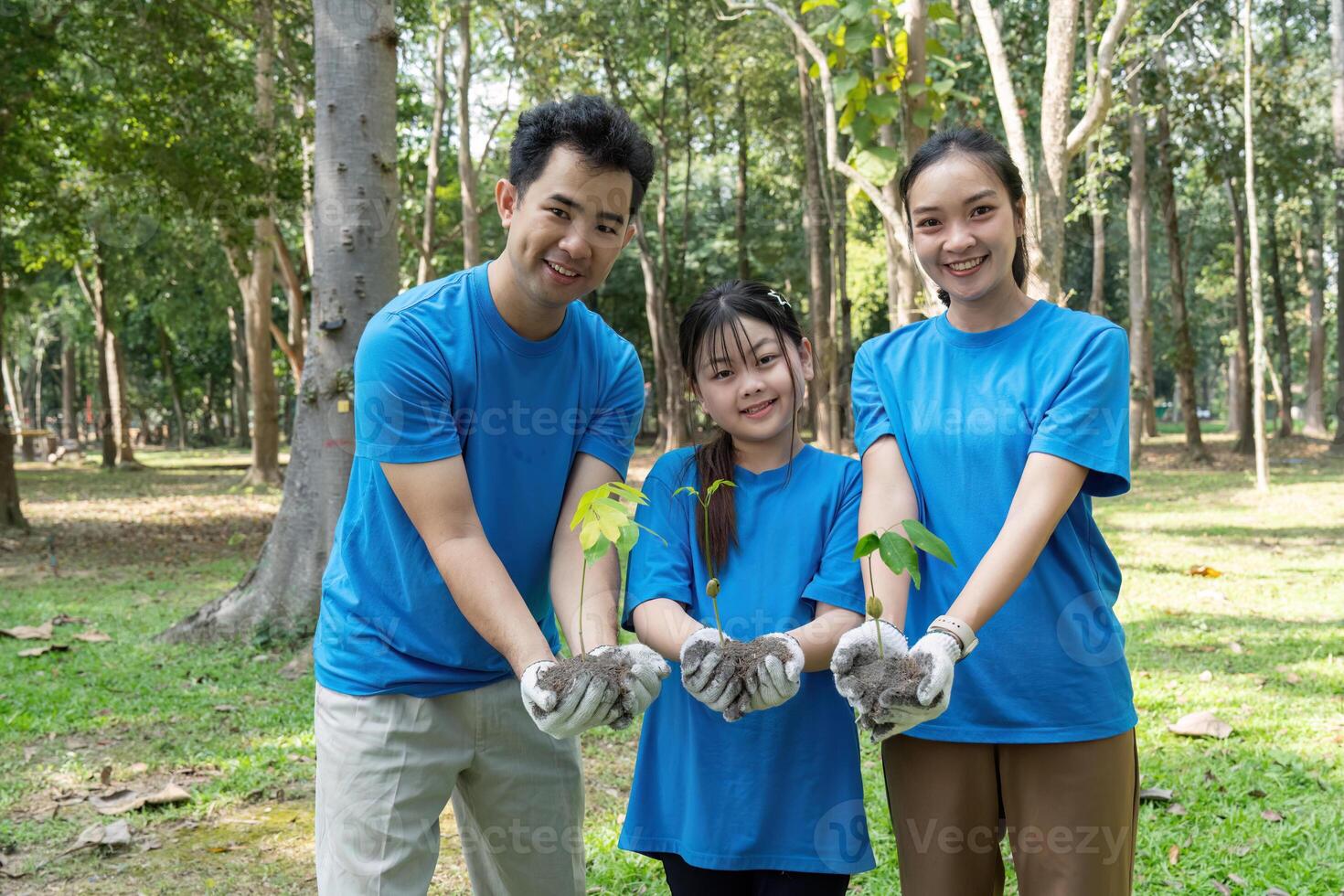 Sustainable Practices and Community Engagement. A joyful group of volunteers uniting for a greener planet by planting trees. photo