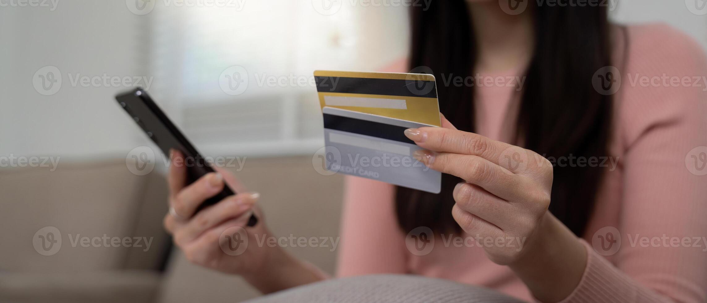 Digital Payments and Financial Planning. A woman preparing for online transactions while juggling multiple credit cards. photo