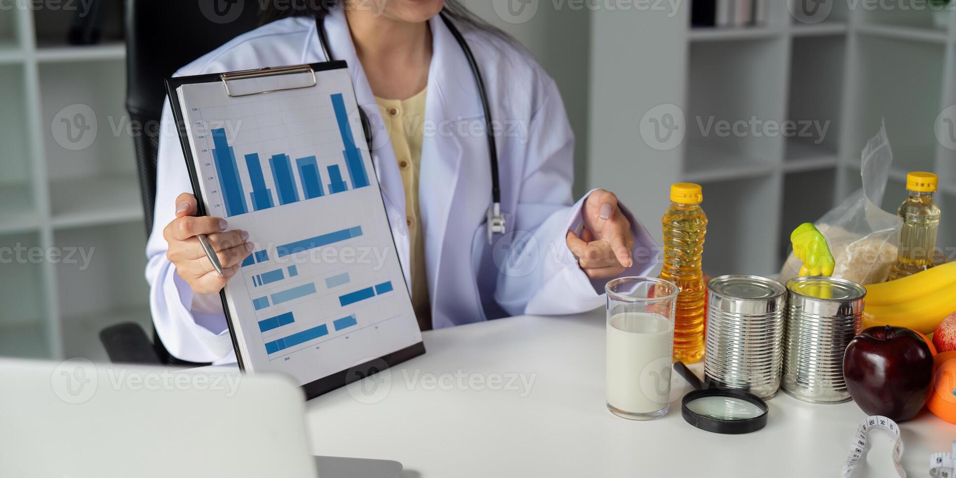 Data Analysis and Dietary Recommendations. A nutritionist presents food analysis data while discussing healthy options. photo