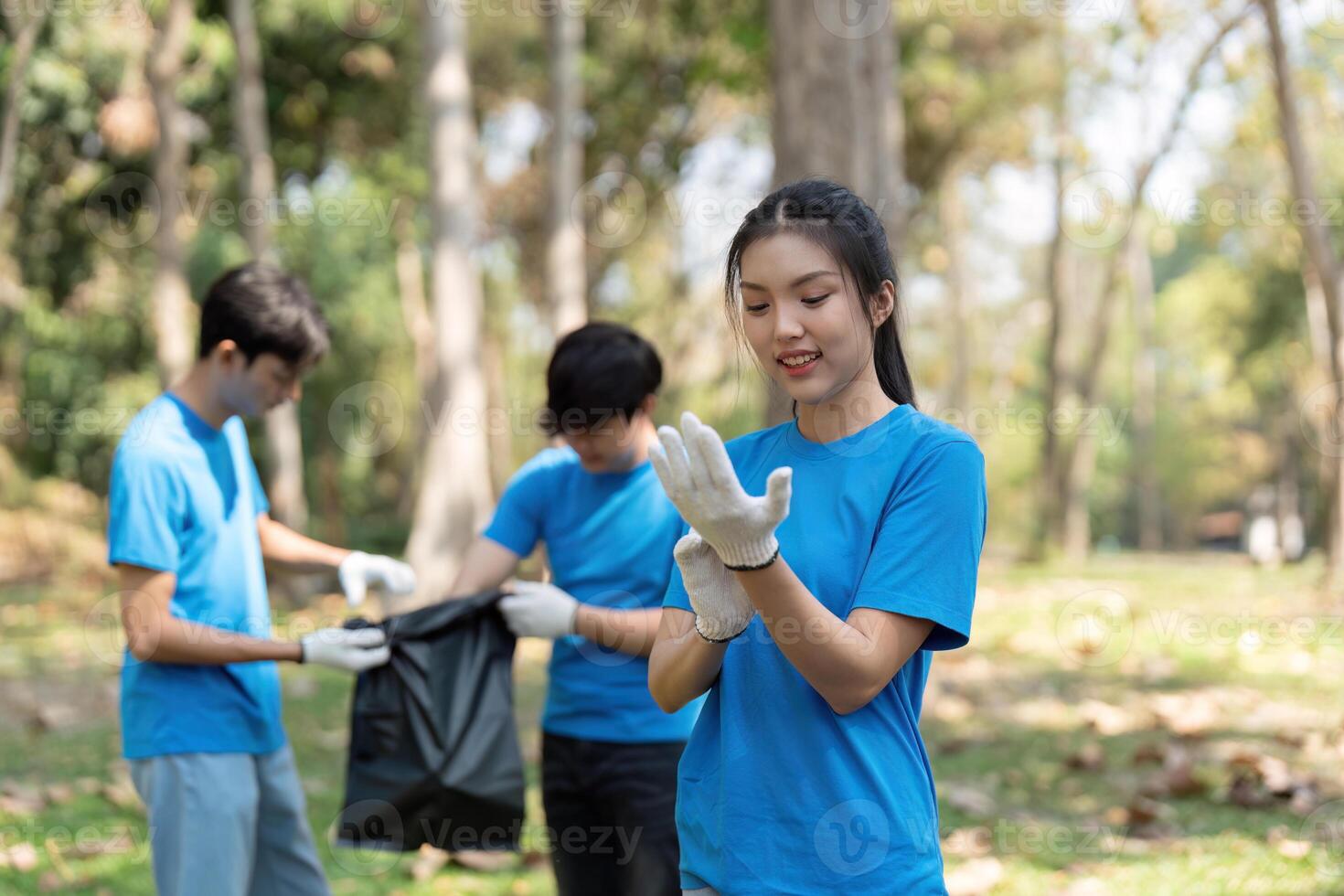 Teamwork and Environmental Stewardship. A volunteer prepares to assist in the clean-up, showing dedication to sustainability in nature. photo
