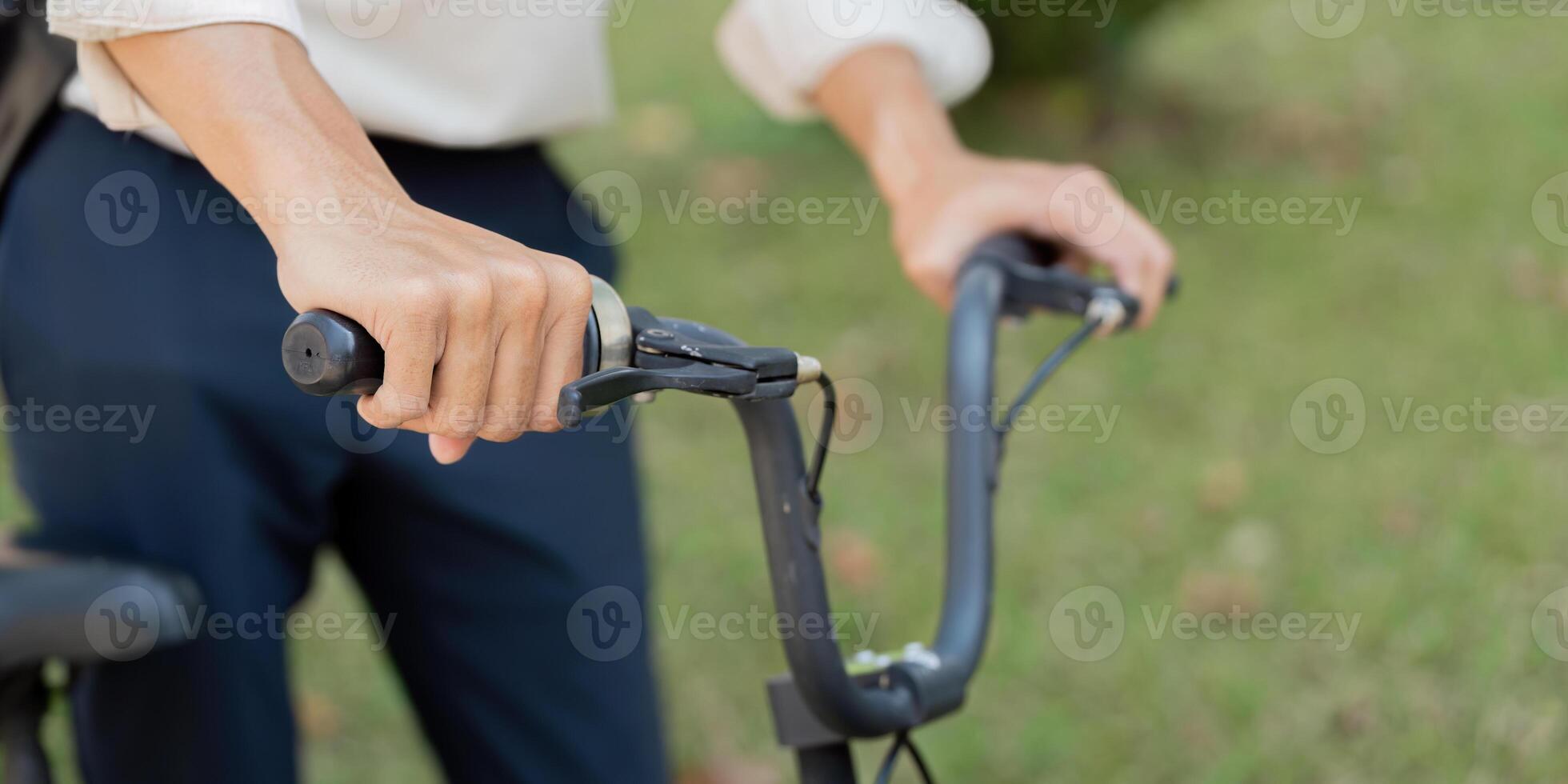 Cycling and Control. A focused individual grips the handlebars of a bicycle, ready for an adventure. photo