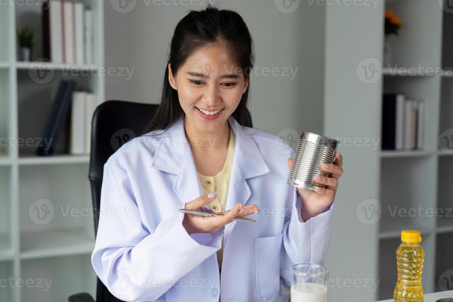 Nutrition and Food Science. A nutritionist examines food labels to provide healthy choices for better diets. photo