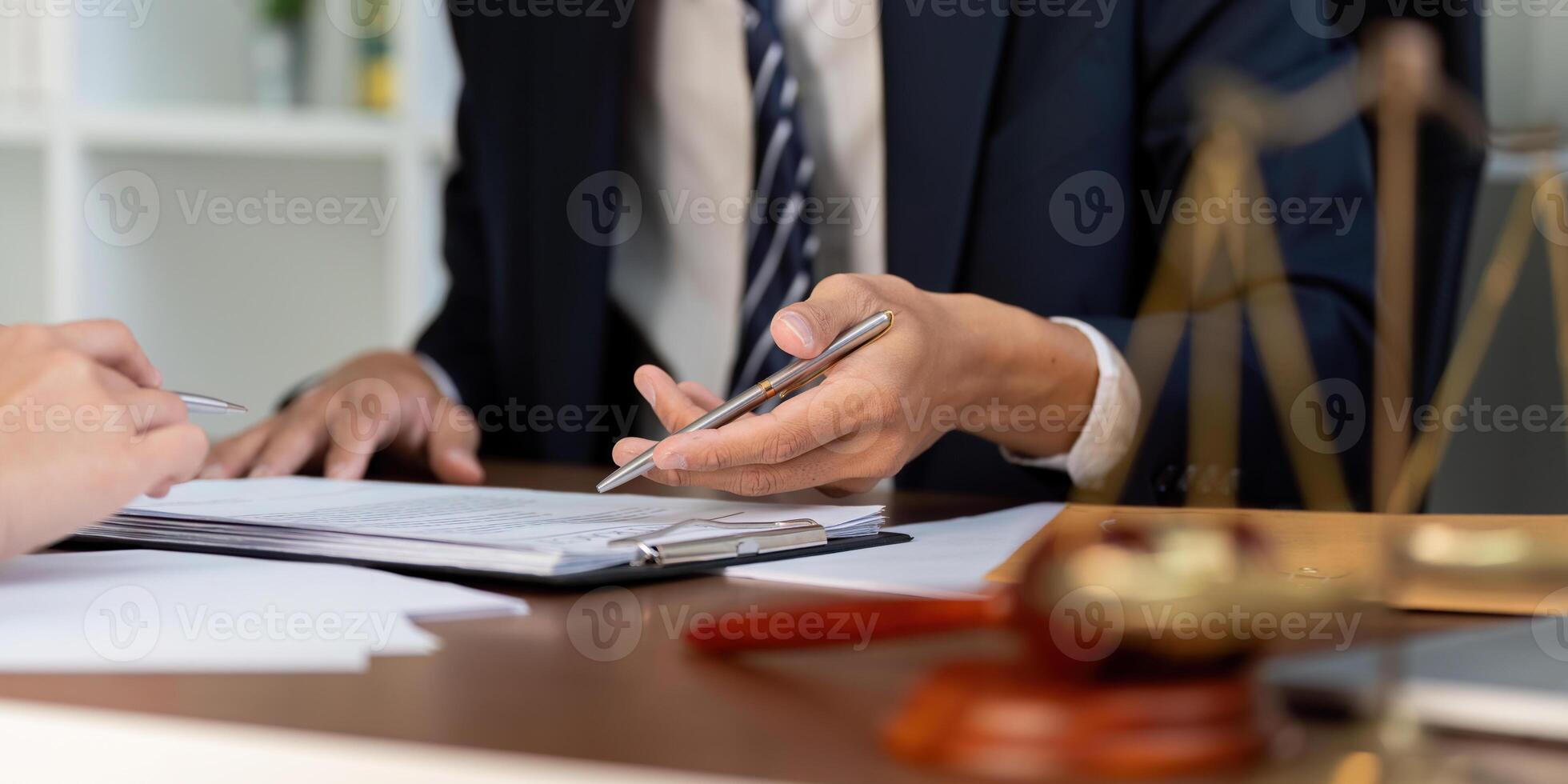 Legal Meeting and Document Review. A lawyer reviewing vital documents with attention to detail. photo