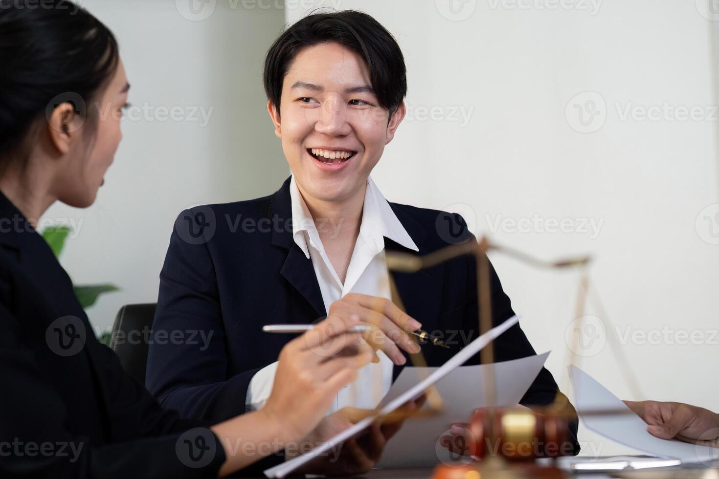 Client Consultation and Legal Support. A lawyer engaging in a candid discussion with clients. photo