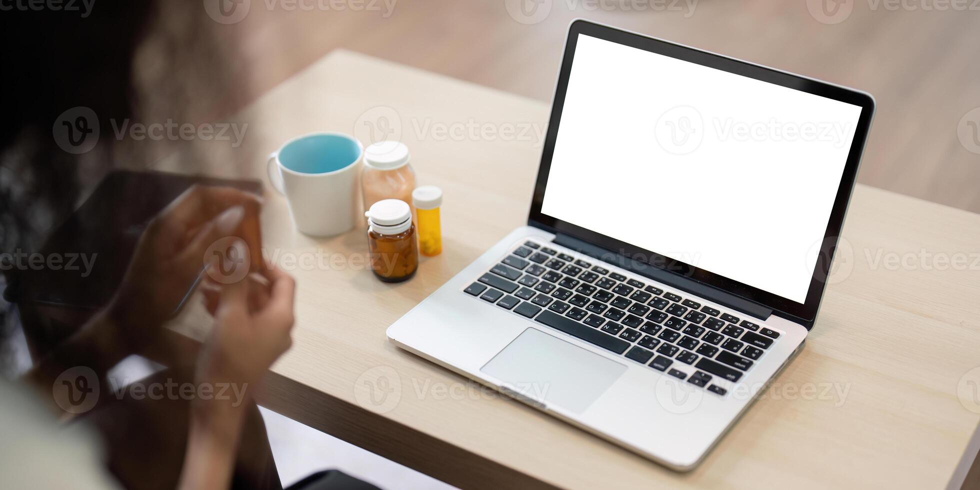 Digital Health and Patient Interaction. A person with a laptop engages in a virtual healthcare session, focusing on medication adherence and health management. photo