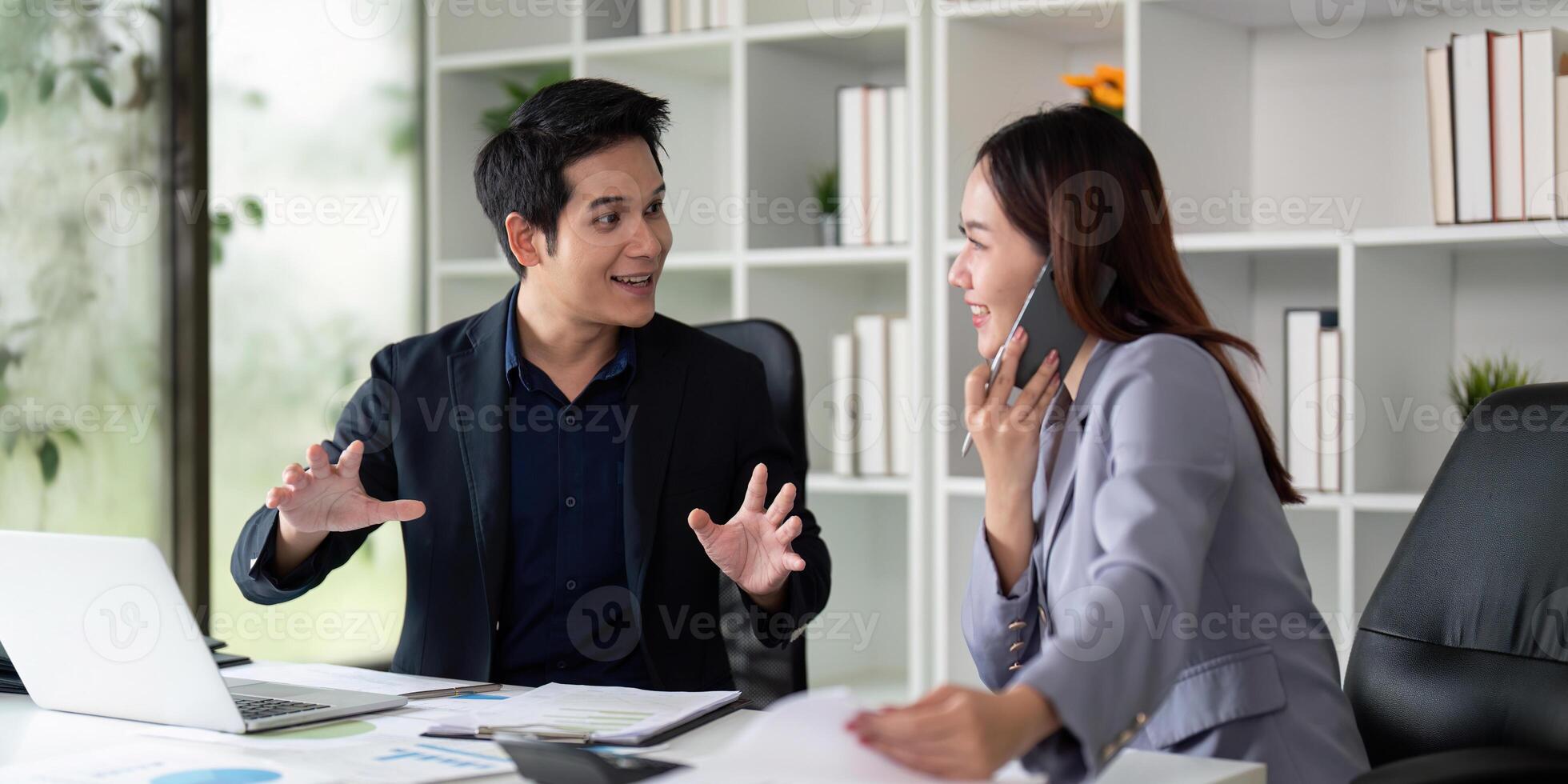 Collaboration and Communication. Colleagues sharing ideas and discussing projects at an office desk. photo