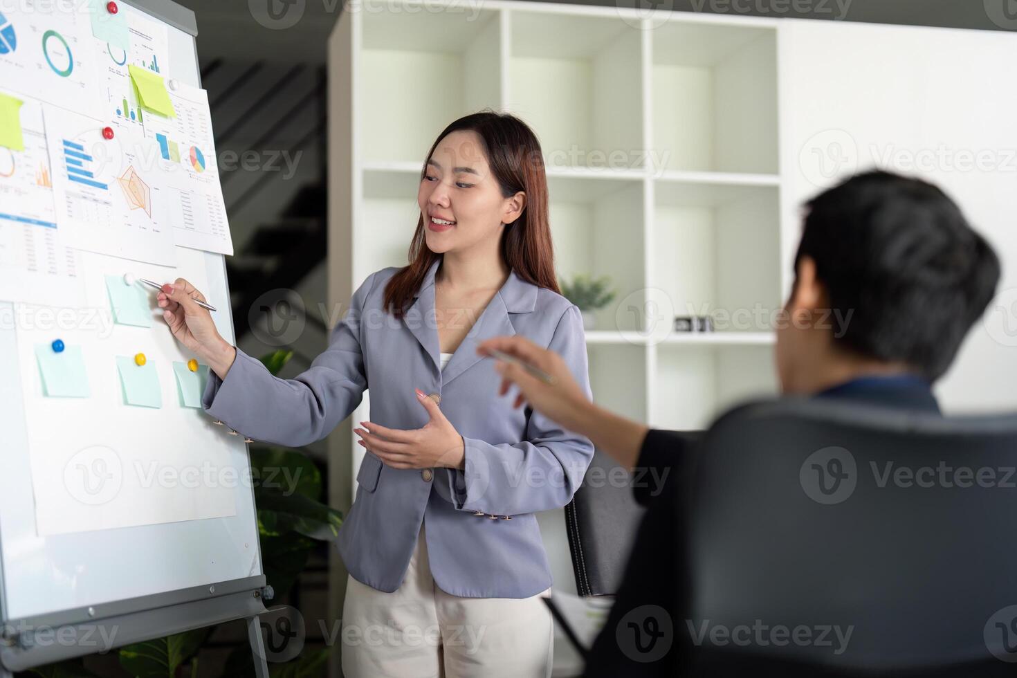 Presentation and Leadership. A colleague presenting ideas during a team meeting in a professional setting. photo