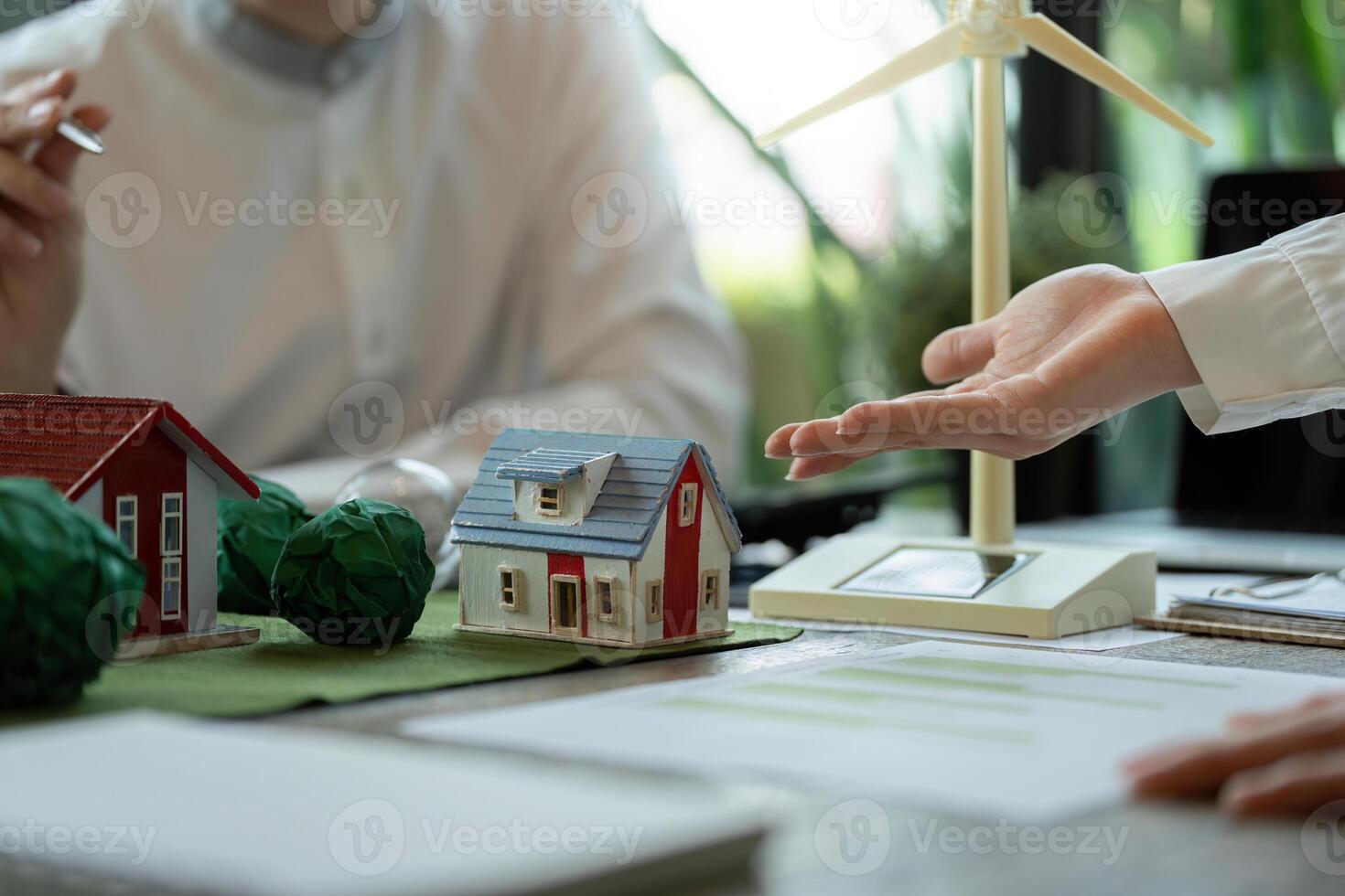 Energy Efficiency and Renewable Resources. Pro professionals evaluating sustainable home solutions. photo