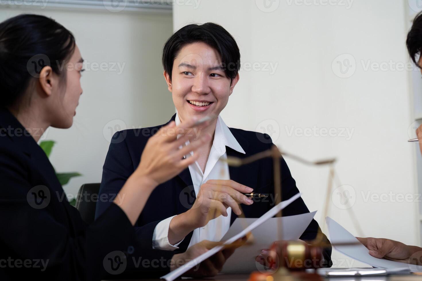 Collaboration and Legal Solutions. A team of attorneys discussing case strategies. photo