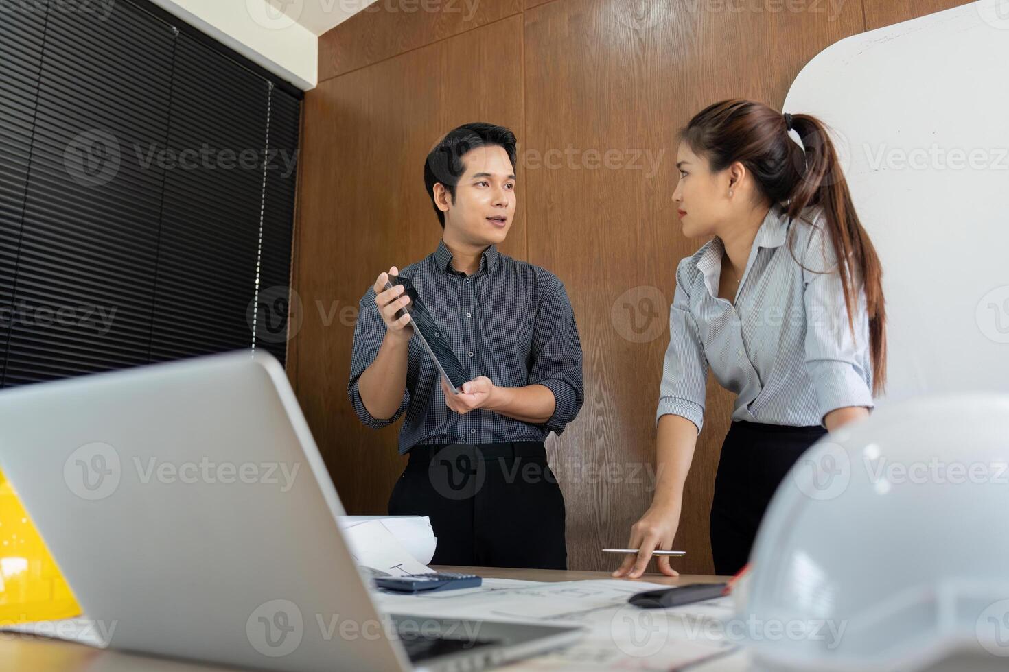 Collaboration and Project Planning. Engineers discussing project ideas at the office. photo