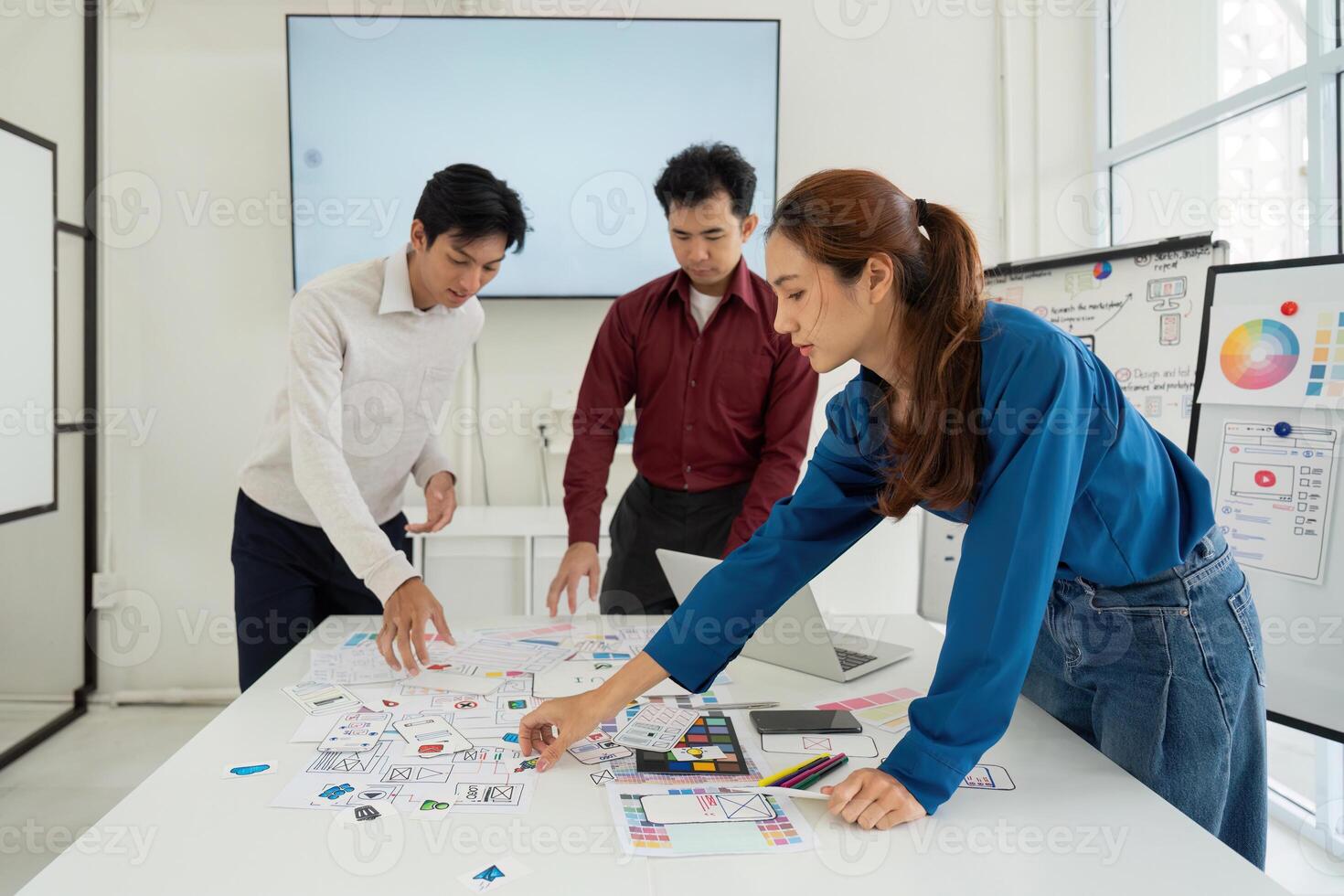 Prototyping and User-Centric Approach. Professionals creating mockups for intuitive user interfaces in a collaborative workspace. photo