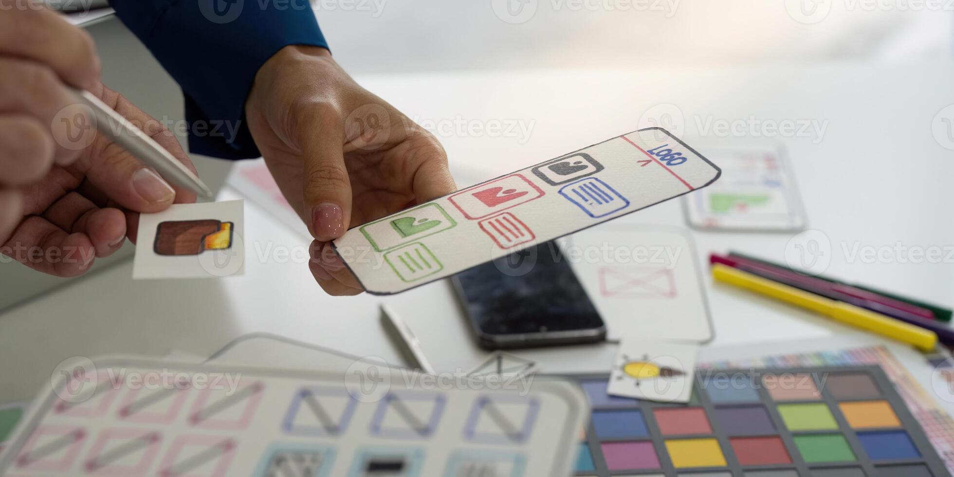 Interactive Design Review Session. Participants analyzing features and components of a digital application. photo