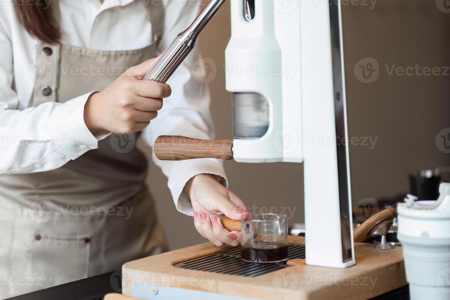 Espresso Making and Precision. A barista pulling a coffee shot at a state-of-the-art espresso machine. photo