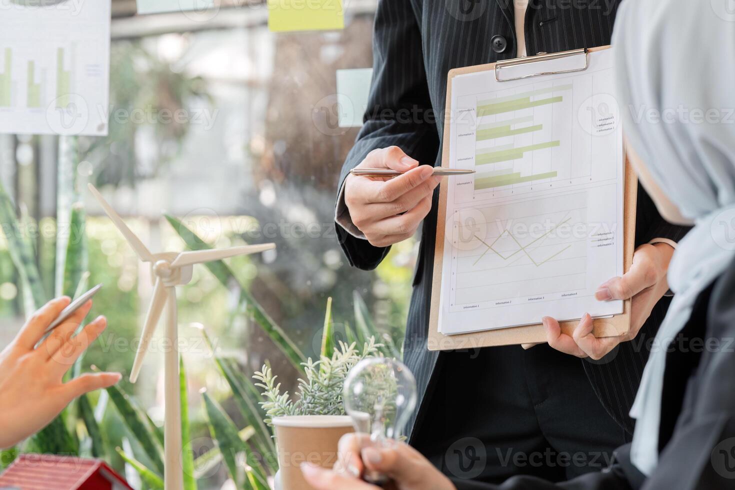 Data Analysis and Eco Sustainability. A professional presents a sustainability report in a corporate meeting. photo